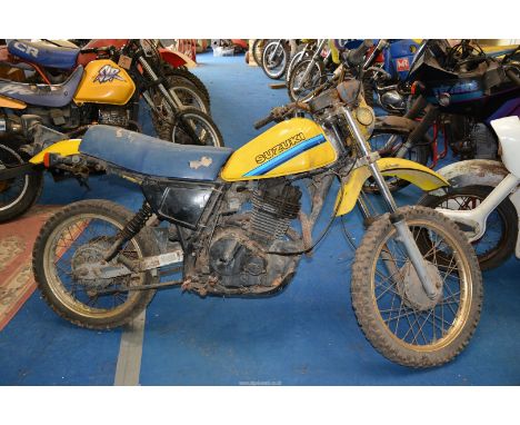 A Suzuki DR500 Motorcycle (1981 to 84), the 498 cc, four-stroke, single cylinder, air cooled engine turns and has good compre