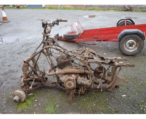 A Suzuki Quad Bike frame, parts and engine/gearbox unit (shaft drive).   Engine does NOT turn.