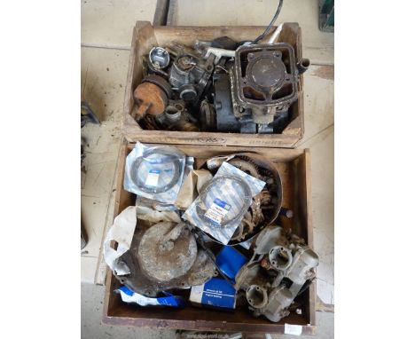 Miscellaneous motorcycle parts including engine components, carburettors, a crankshaft and connecting rod, a piston, a piston