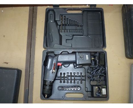 A cased 12 volt cordless Drill with a charger, screwdriver bits and sockets, drill-bits, etc., Appears unused.