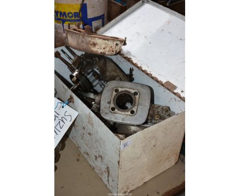 A steel toolbox containing Suzuki 120? (believed 118 cc) two-stroke, single cylinder, air cooled engine components (No. B100-