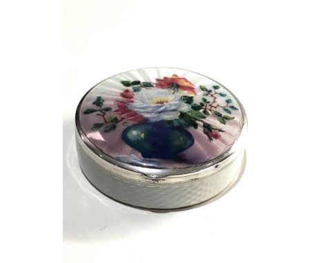 A Fine silver and enamel lidded box with floral enamel lid measures approx 5cm dia by 1.7cm 925 silver import hallmark please