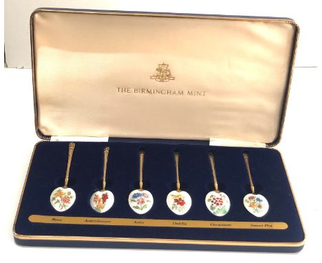 Boxed set of 6 silver and enamel spoons birmingham silver hallmarks with gold gilt by the Birmingham mint in good condition 