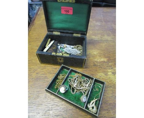 A small jewellery box containing a papier-mache snuff box, gold plated and gold coloured chains, penknives, mixed brooches to