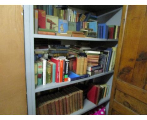 Three shelves of assorted books to include G A Henty By Sheer Pluck - A Tale of Ashanti War, AA Milne When We Were Very Young