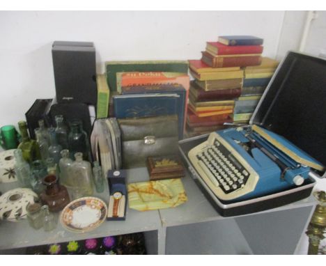 Book, board games DVDs, a vintage Imperial typewriter, ceramics and a bottle collectionLocation: G 