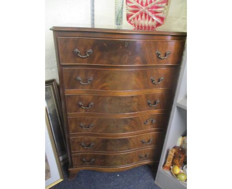 An early 20th century mahogany serpentine fronted six drawer chest of drawers, standing on bracket feet, 40 1/2" x 27"Locatio