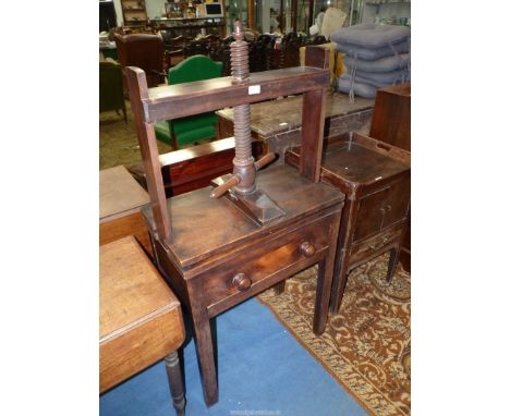 A collectable 19th c. clothes/flower Press Table, having a frieze drawer and standing on square legs, the threaded wooden pre