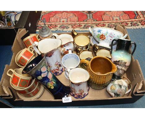 A quantity of jugs, vases etc. including Moorcroft vase (damaged), Wade jugs and tankard, Wedgwood 'Eastern Flowers' jug, Stu