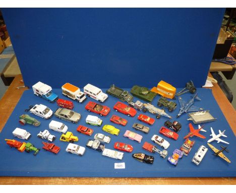 A quantity of die cast toy vehicles and airplanes including Road Roller, Ferrari Testarossa, Centurion tank, Phantom II, etc.