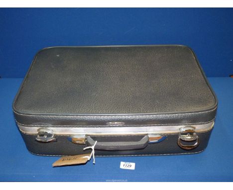 A 1960's Antler suitcase and vintage contents; antler handle carving set, leather tape measure, mixed wood trinket pot etc.