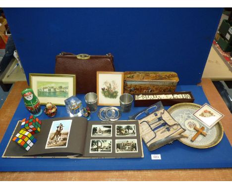 A quantity of miscellanea including Rubic cubes, Dominoes, ladies vintage handbag, postcard album, Russian dolls, etc.