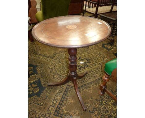 A circular Mahogany/Walnut occasional Table, the top with light and darkwood rope stringing and with a central shaded circle,