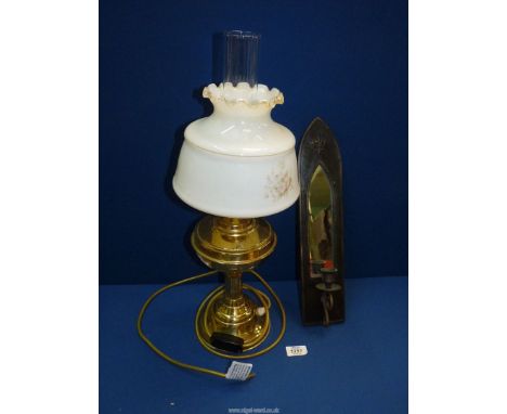 An oil lamp converted to electric, with brass base, 21'' tall together with a mirror backed wall sconce.