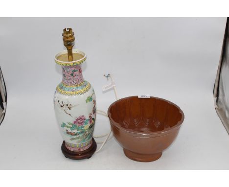 A large brown Stoneware jelly mould and a Chinese vase converted to a table lamp.