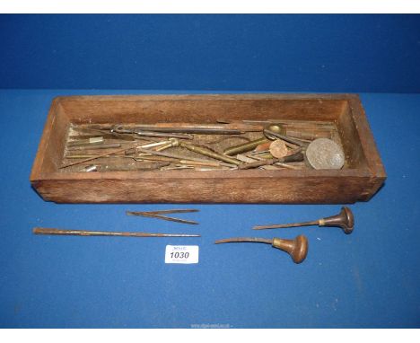 A wooden box of Watchmaker's tools.