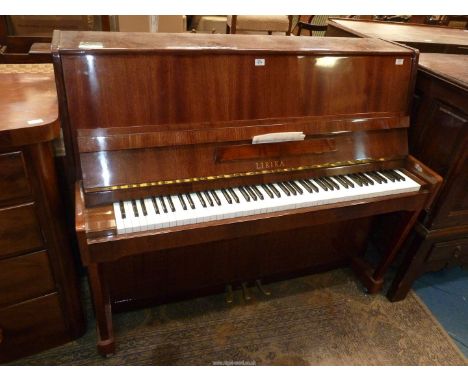 A 6 1/2 octave overstrung iron framed Upright Piano by Lirika, serial no. 248829, 57'' wide x 25 1/2'' deep x 47'' high.