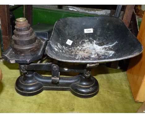 A large set of Victorian cast iron kitchen scales and weights