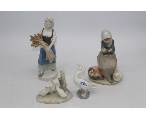 Three Lladro figures and one Nao figure.