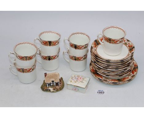 A 'Sutherland' china, part tea set to include seven cups and ten saucers and two plates, plus small Palissy trinket pot and L