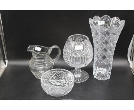 Four large pieces of glass to include: cut glass water jug, a large goblet, a tall pressed vase with fan shapes edge, etc.