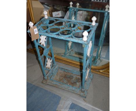 A 19th century cast iron Stick/Umbrella Stand, with tray, blue and white painted, 17" wide x 28 1/2" high x 9 1/2"deep.