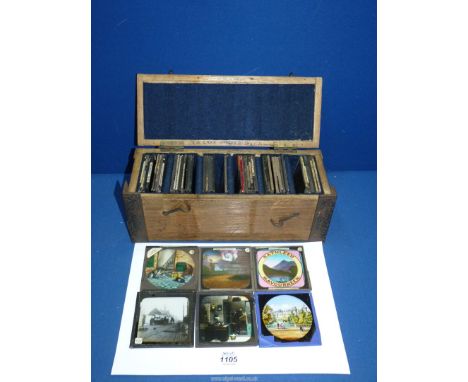 A quantity of Magic Lantern slides (50) in wooden case including 'Warwick Castle', humorous, etc.