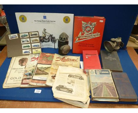 A quantity of automobilia related items to include 'The Autocar' magazine, 'Bullseye' lantern, Carbide Bicycle lamp, cigarett
