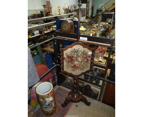 A Regency Pole Screen on spiral stem standing on three scroll feet, with matching sides, floral tapestry panel, 56" high over