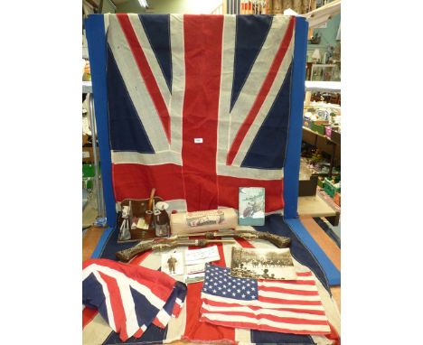 A quantity of miscellanea to include two fabric Union Jack flags, two replica pistols, pipe stand with clay pipes, military p