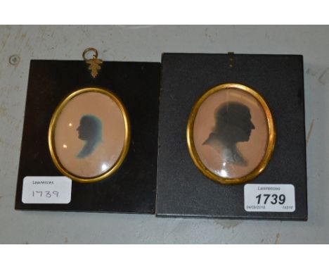 Two 19th Century oval silhouette portrait pictures of gentlemen housed in rectangular papier mache frames