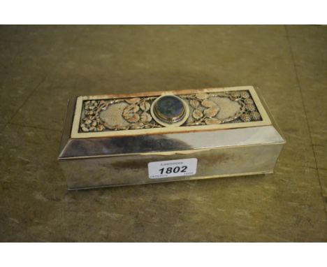 Early 20th Century rectangular silver plated on copper trinket box, the hinged cover inset with a Ruskin pottery plaque CONDI