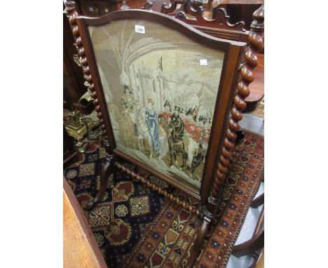 Victorian mahogany firescreen with barley twist frame and scroll supports inset with a needlework panel depicting a Victorian