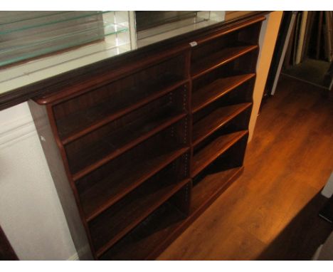 Mahogany twin section five shelf open bookcase with plinth base