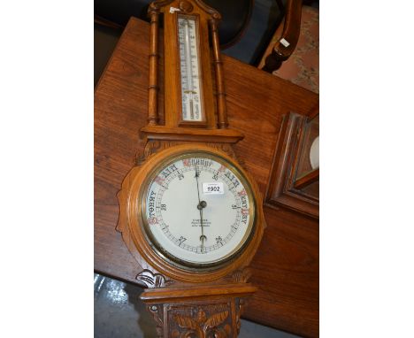 Late Victorian carved oak aneroid barometer thermometer, the ceramic dial inscribed Carters Royal Seedsmen, High Holburn
