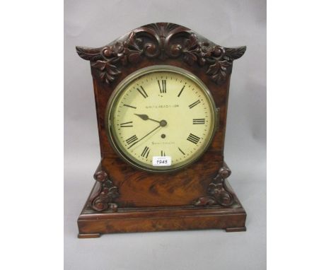 Early Victorian figured mahogany bracket clock, the case with applied, carved and floral decoration above a plinth, the paint