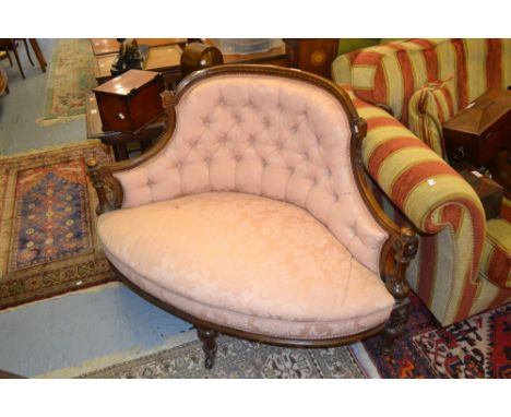 Victorian walnut and button upholstered two seat corner sofa upholstered in pink damask on turned supports with brass and cer