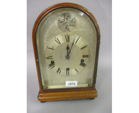 Early 20th Century mahogany dome top bracket clock, the silvered dial inscribed ' Tempus Fugit ' with Roman numerals, the two