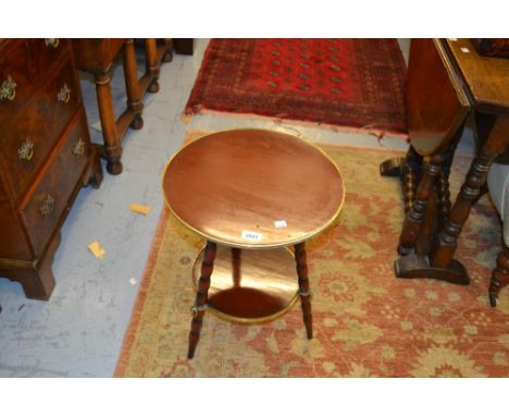 Early 20th Century circular mahogany and brass mounted two tier occasional table on bobbin supports