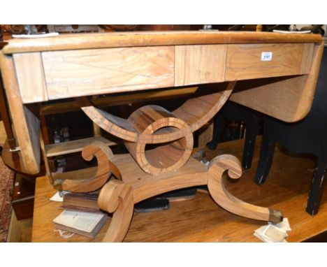 Bleached walnut drop-leaf sofa table with two frieze drawers and shaped support with swept legs having brass paw caps and cas