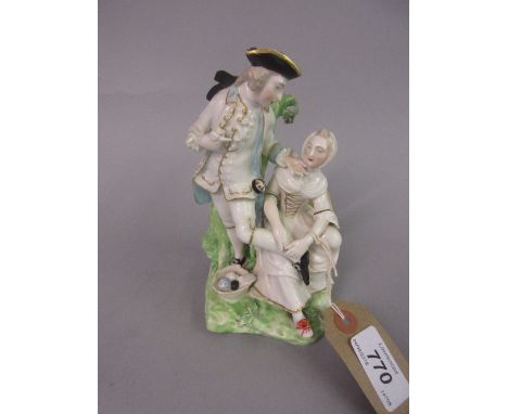 18th Century Derby group of a seated lady and standing beau before a tree trunk, 6.25ins high (slight damages and losses)   C