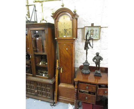 George III mahogany longcase clock, the arched hood with brass finials with flanking pilasters above an arched panel door and