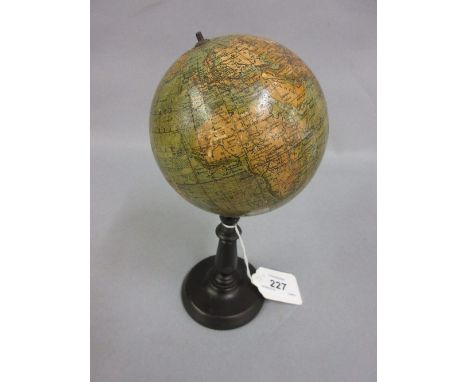 Small 19th Century globe on a turned ebonised stand with inset compass, the globe 4ins diameter   CONDITION REPORT  Some loss