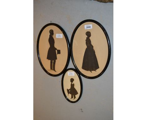 Pair of 19th Century gilt heightened watercolour silhouette portraits of a lady and gentleman together with another similar s