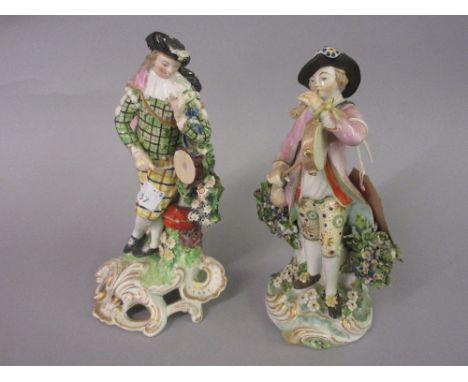 18th Century Derby figure of a male musician playing a pipe and tambourine, 7.5ins high together with another of a figure wea