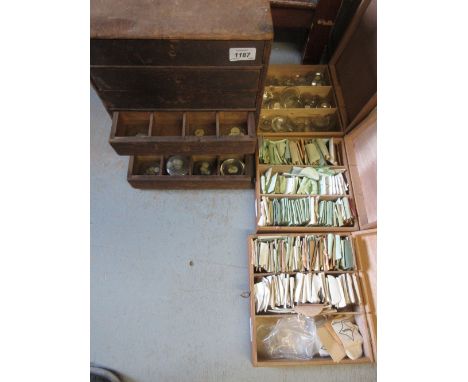 Large quantity of pocket watch glasses housed in a six drawer pine cabinet and three other wooden boxes, together with a smal