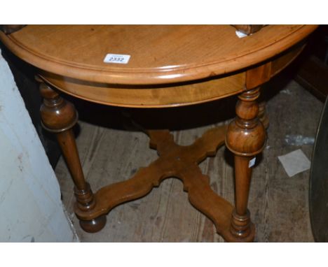 Early 20th Century circular walnut occasional table on turned tapering supports with shaped stretcher, together with a reprod