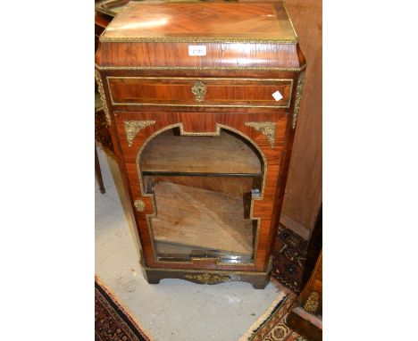 19th Century French kingwood, rosewood and ormolu mounted pier cabinet with a single drawer above glazed door, raised on brac