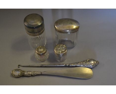 925 Silver mounted glass smelling salts bottle, three silver mounted glass dressing table jars and a silver handled button ho