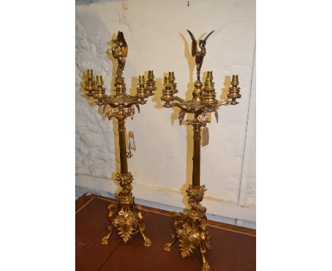 Pair of 19th Century gilt brass five light candelabra in Regency style, each surmounted by a figure of a crane above a fluted